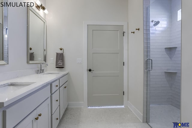 bathroom with vanity and a shower with shower door