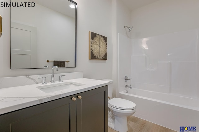 full bathroom featuring bathing tub / shower combination, vanity, toilet, and hardwood / wood-style floors