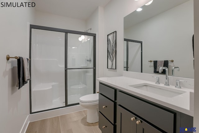 bathroom featuring walk in shower, vanity, toilet, and hardwood / wood-style flooring