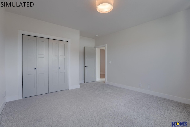 unfurnished bedroom with carpet flooring and a closet