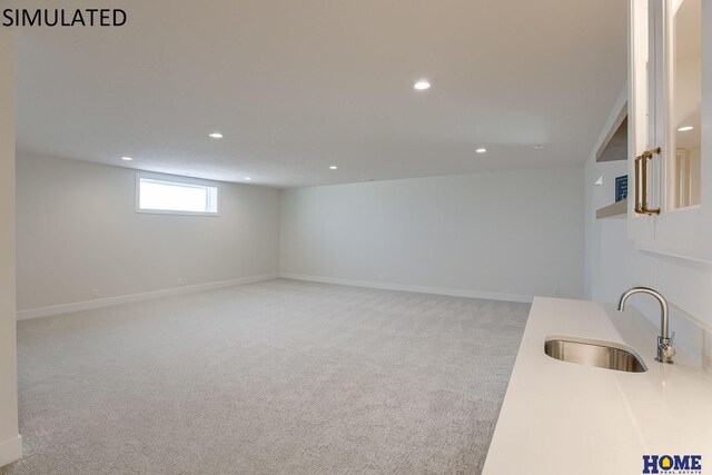 interior space with light carpet and sink