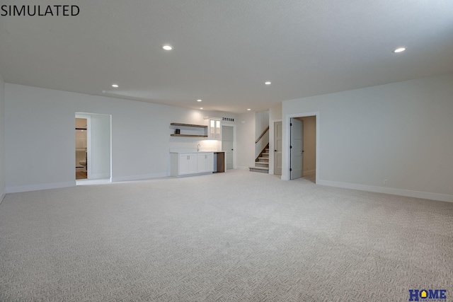 unfurnished living room featuring light colored carpet