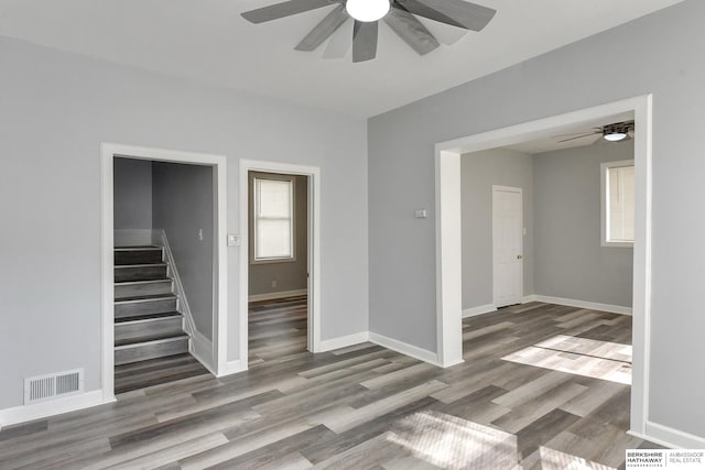 unfurnished room featuring wood-type flooring and ceiling fan