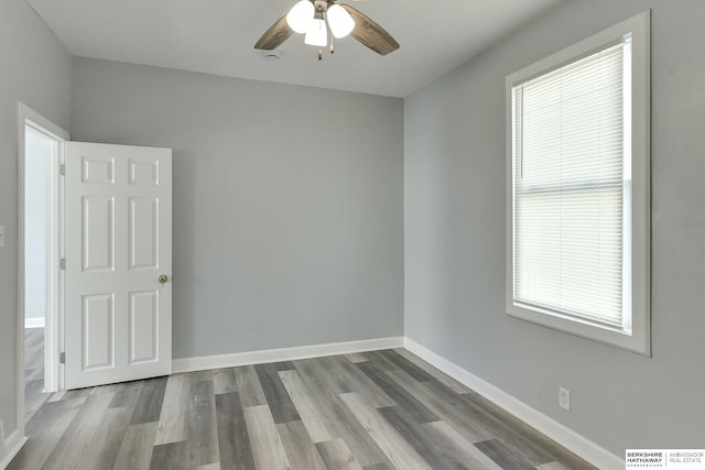 unfurnished room featuring ceiling fan and light hardwood / wood-style flooring