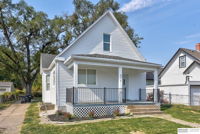 view of front of home with a front lawn and covered porch