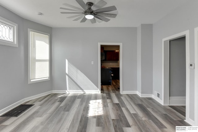 interior space featuring light wood-type flooring and ceiling fan