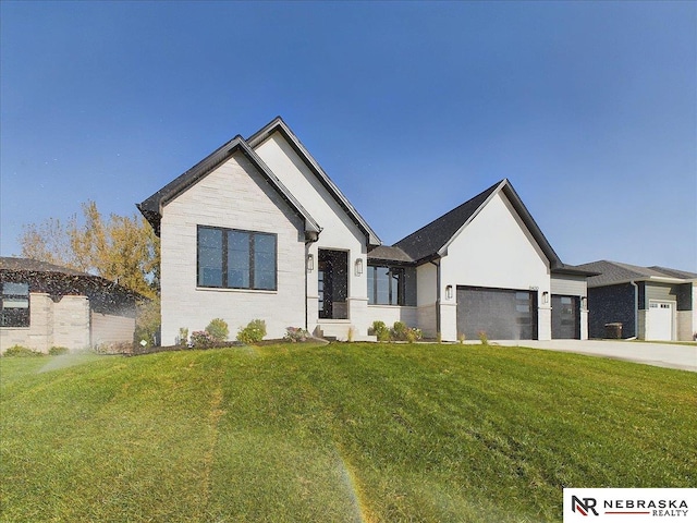 view of front facade featuring a front yard and a garage