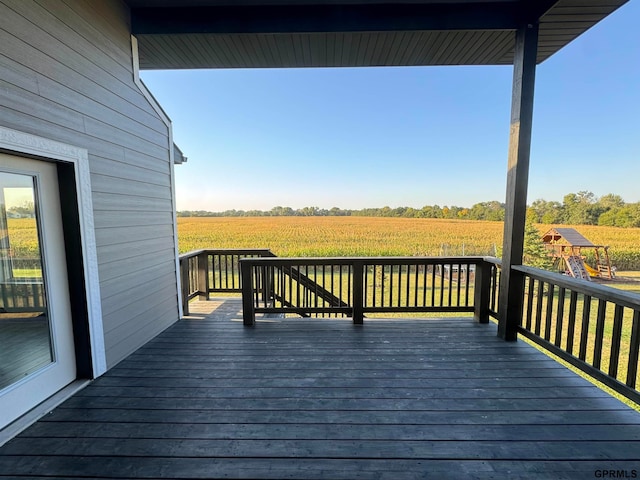 wooden deck with a rural view