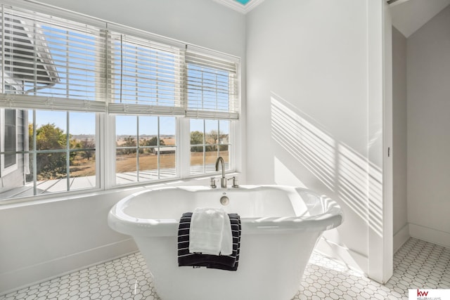 bathroom featuring a bath and tile patterned flooring