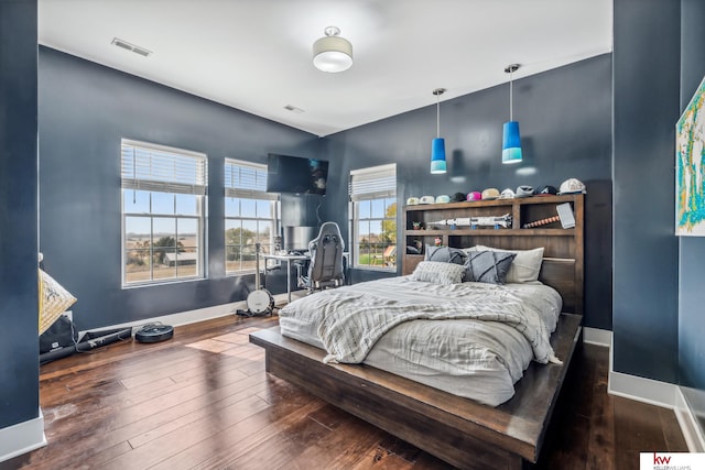 bedroom featuring dark hardwood / wood-style flooring