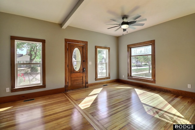 entrance foyer with light hardwood / wood-style floors, ceiling fan, and beamed ceiling