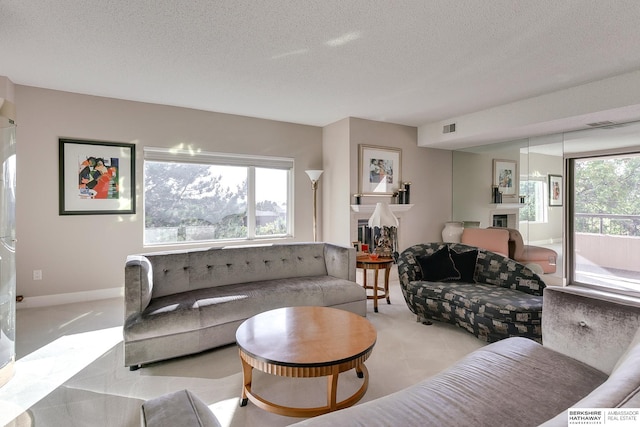 living room featuring a textured ceiling