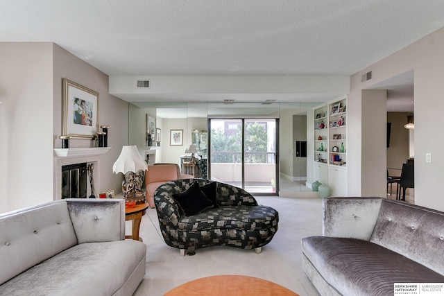 living room with light colored carpet and a textured ceiling