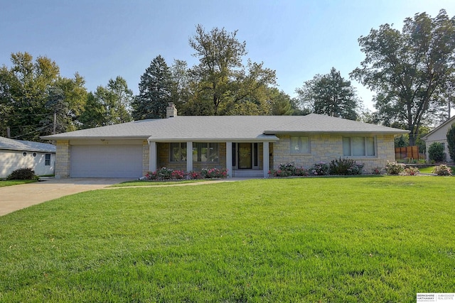 single story home with a front yard and a garage