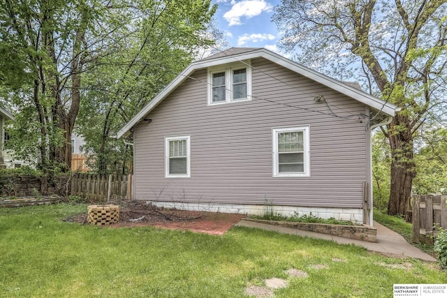 view of property exterior with a yard