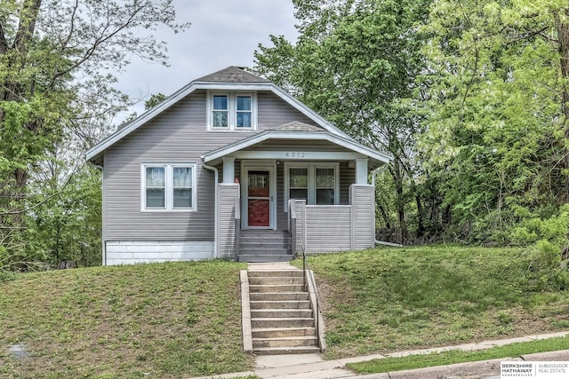 bungalow with a front lawn