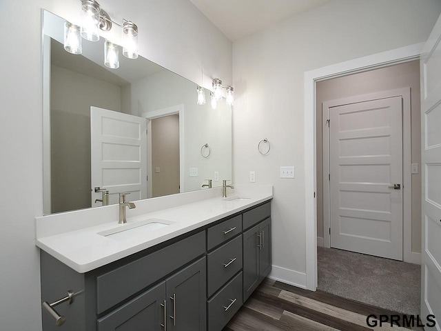 bathroom featuring hardwood / wood-style flooring and vanity