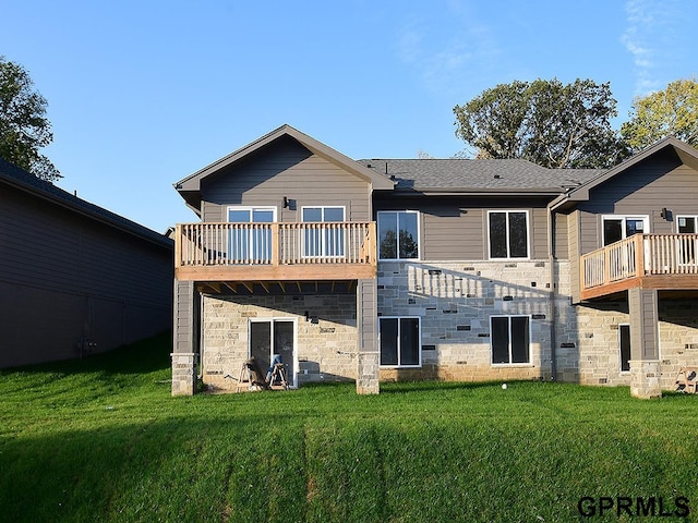 back of house with a yard and a deck