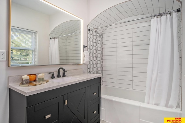 bathroom with shower / bath combination with curtain and vanity