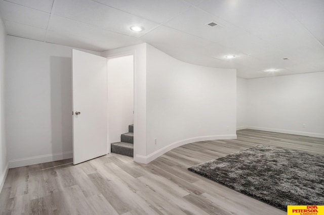 basement featuring light hardwood / wood-style flooring