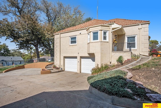 view of side of home with a garage