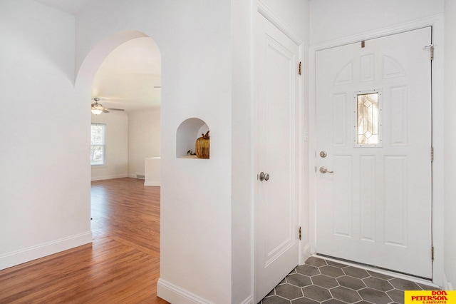 entrance foyer featuring ceiling fan and dark hardwood / wood-style flooring