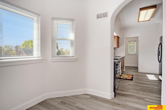 interior space with light hardwood / wood-style flooring and a healthy amount of sunlight