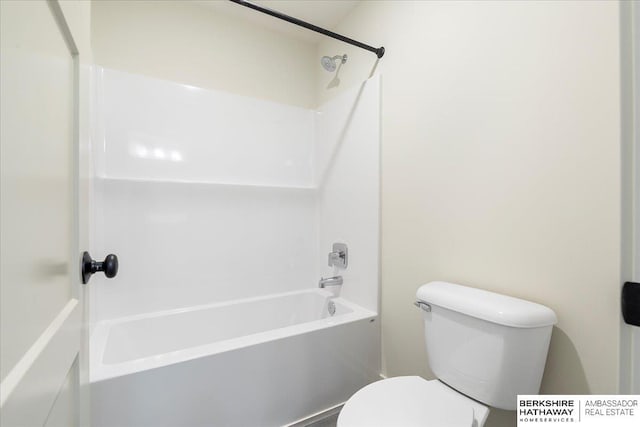 bathroom featuring toilet and shower / bath combination