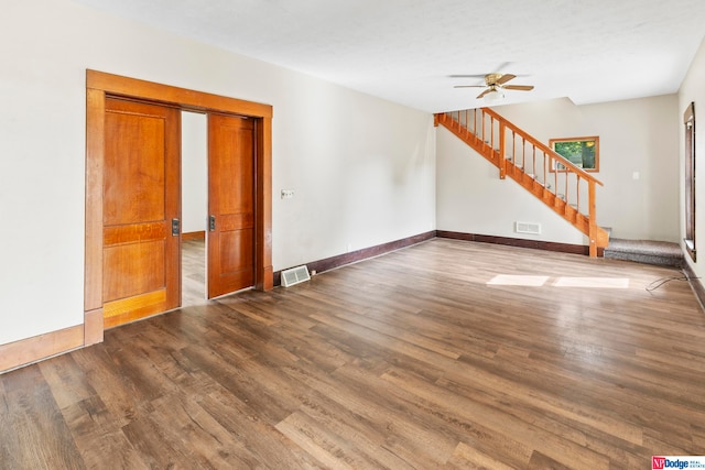 interior space with ceiling fan and wood-type flooring