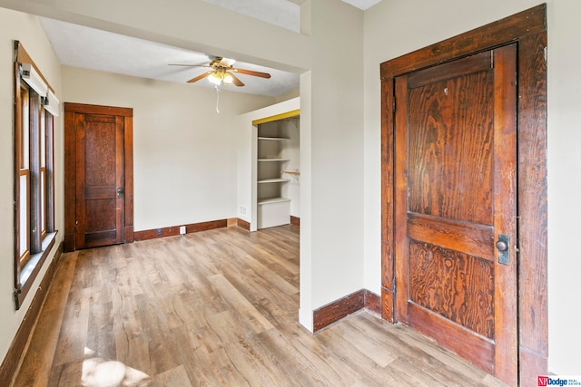 entryway with light wood-type flooring and ceiling fan