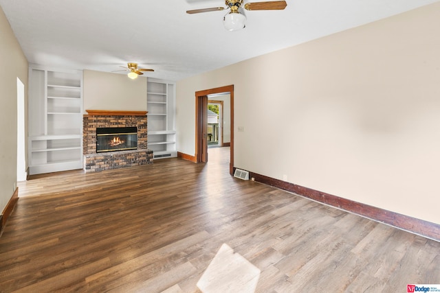 unfurnished living room featuring a fireplace, ceiling fan, and hardwood / wood-style floors