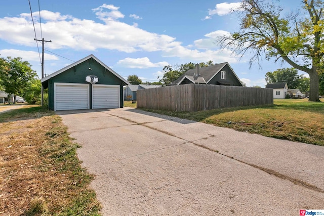 garage featuring a lawn