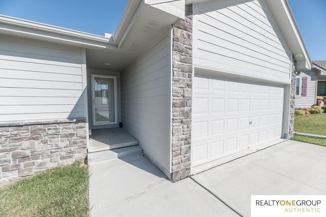 entrance to property featuring a garage