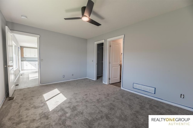 unfurnished bedroom featuring carpet flooring and ceiling fan