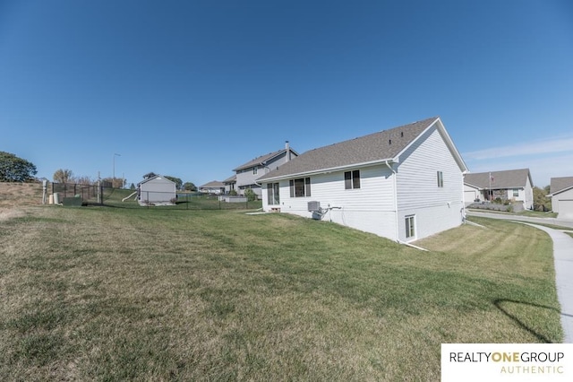 rear view of property with a lawn