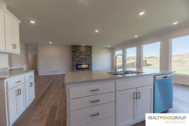 kitchen with white cabinets, sink, a healthy amount of sunlight, and stainless steel dishwasher