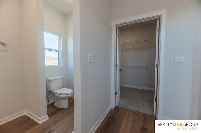 bathroom featuring toilet and hardwood / wood-style floors