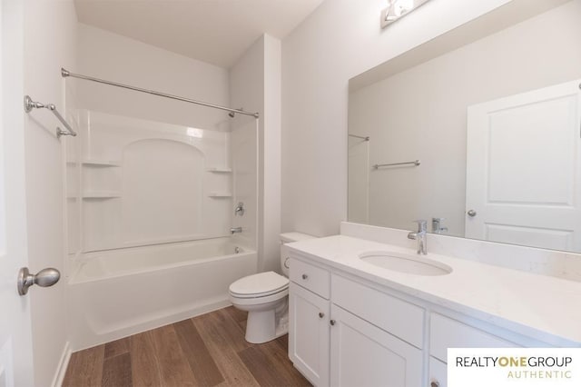 bathroom featuring tub / shower combination, wood finished floors, toilet, and vanity