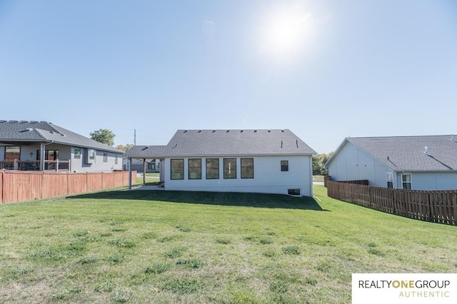 back of house featuring a yard