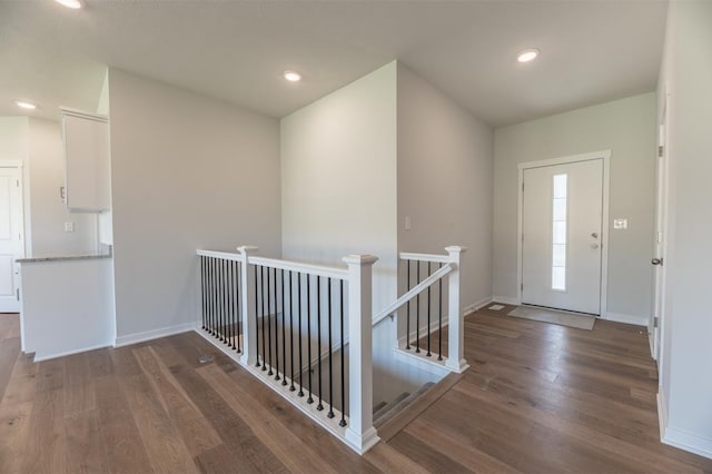 foyer with baseboards, recessed lighting, and wood finished floors