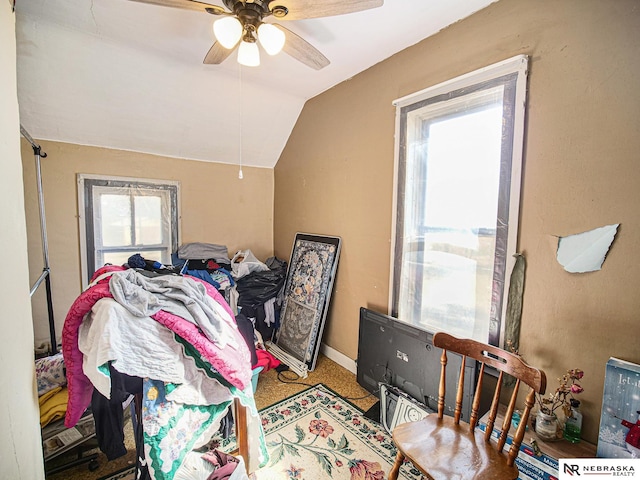 carpeted bedroom with lofted ceiling, multiple windows, and ceiling fan