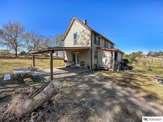 rear view of property with a patio area