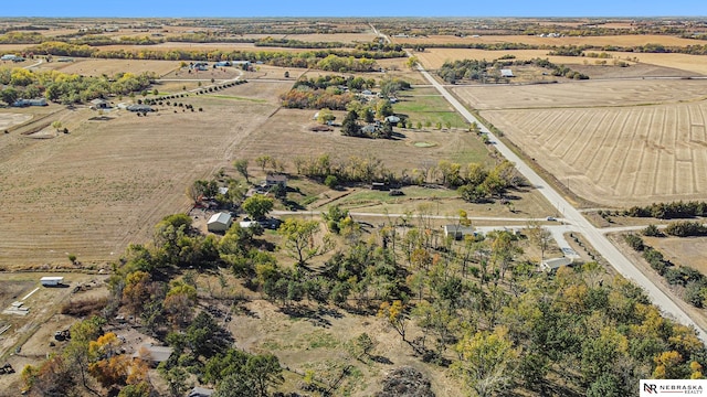 birds eye view of property with a rural view