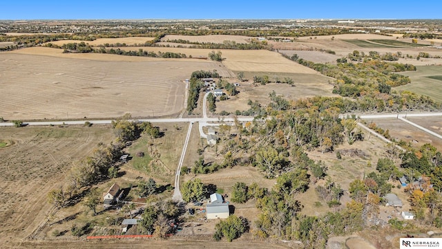 birds eye view of property with a rural view