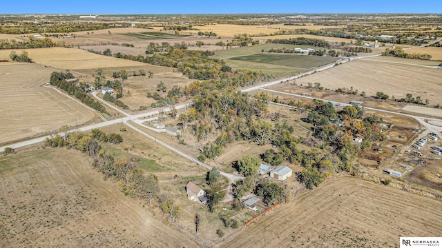 birds eye view of property with a rural view