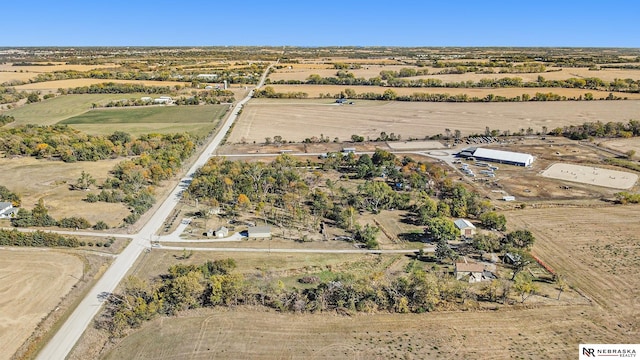 birds eye view of property featuring a rural view