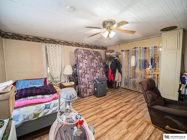 bedroom with ceiling fan and light hardwood / wood-style flooring