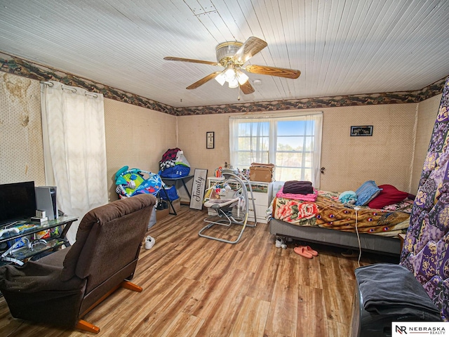 bedroom with wood-type flooring and ceiling fan