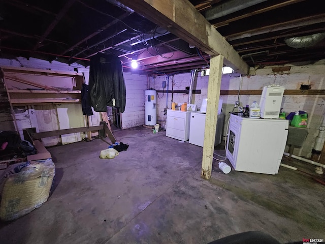 basement featuring independent washer and dryer and water heater