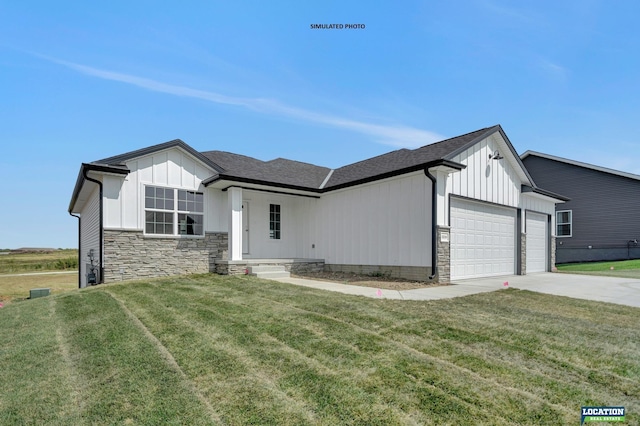 view of front of property featuring a front lawn and a garage